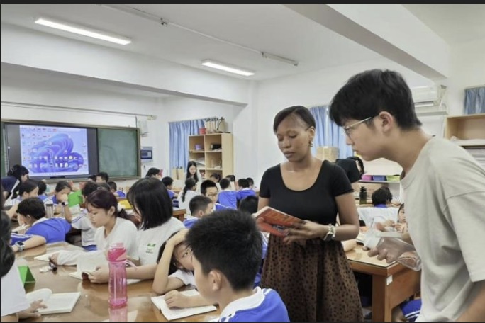 Volunteer reading with a young student